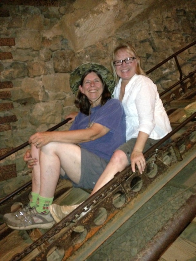Joy and me in the cart that used to take miners down that shaft.