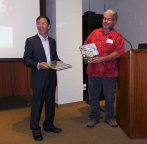 Tom Carruth presenting Dr Wang with some books. The actual award would be given to him at the East Coast version of Great Rosarians.